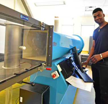 A person operating a laboratory equipment